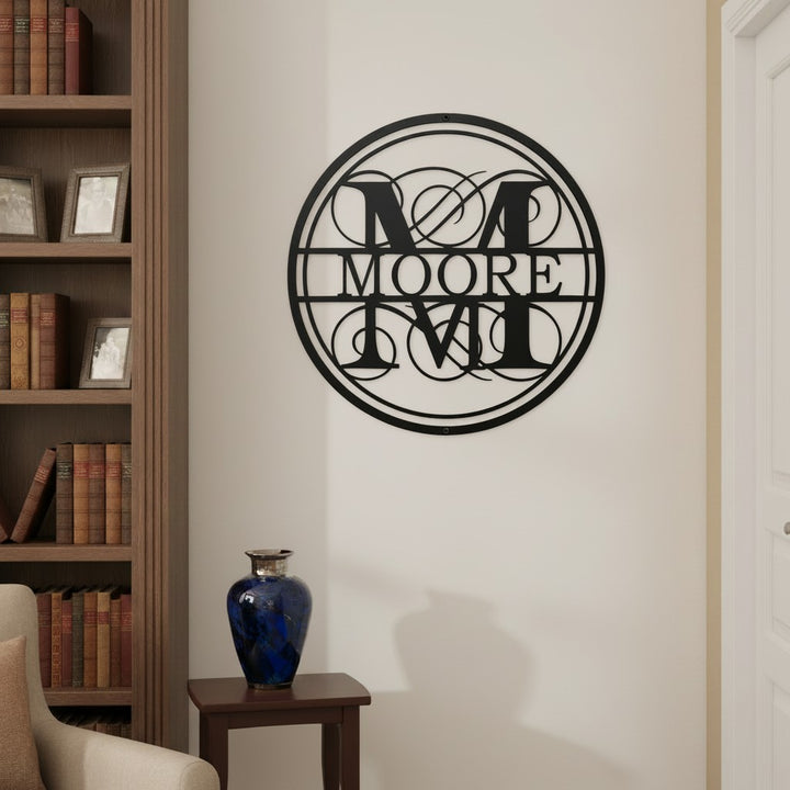 Custom family monogram metal sign — personalized surname wall art featuring an elegant circular monogram displayed in a home library and living space.