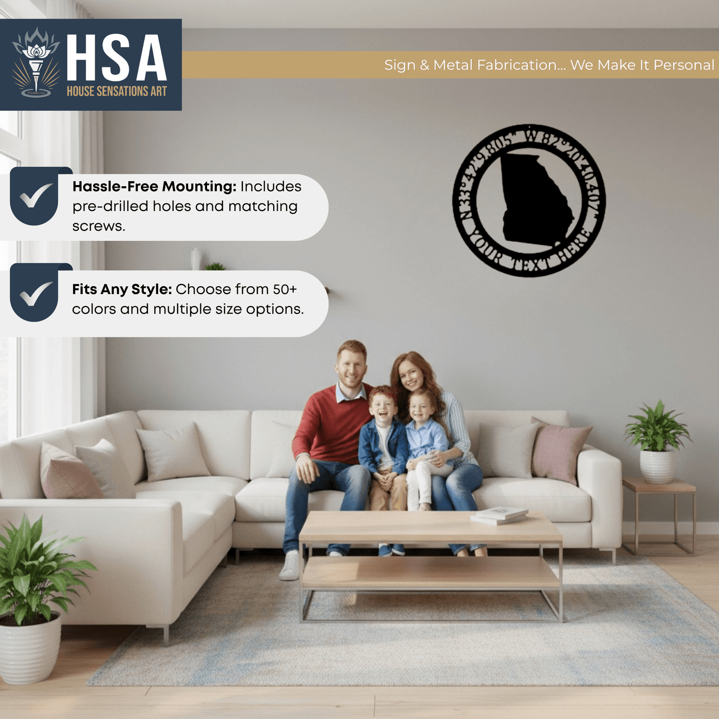 Family sitting on couch in living room with personalized metal wall art featuring a map of Georgia, decorative GPS coordinates sign