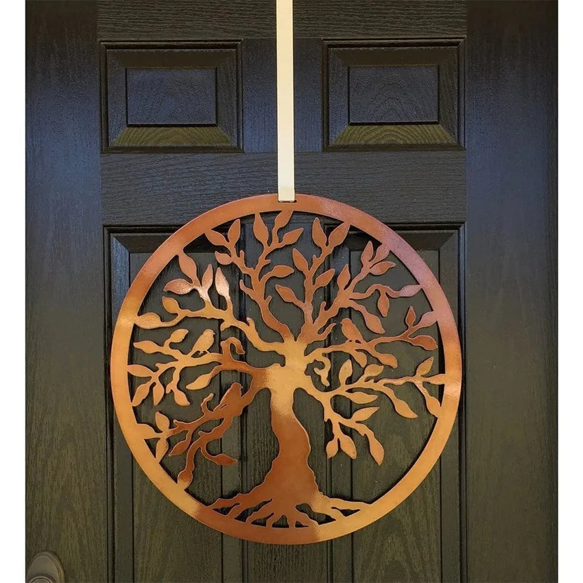 Close-up of bronze Tree of Life metal wreath on a front door