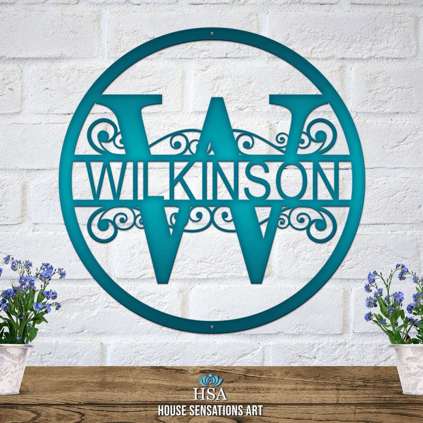Personalized decorative metal family monogram sign for the last name “WILKINSON,” displayed on a white brick wall, showcasing elegant design and durable craftsmanship by House Sensations Art.