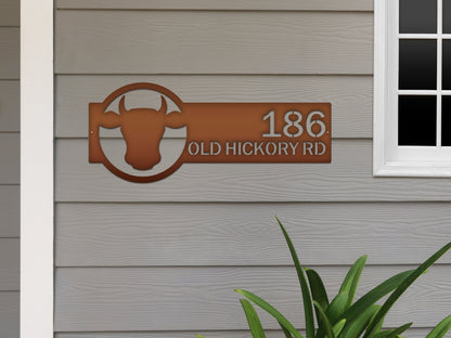 Cattle Farm Monogram Address Sign featuring a cow logo and personalized street numbers, crafted from durable steel. Ideal for outdoor home décor, blending rustic charm with modern precision.