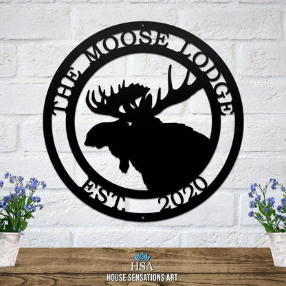 Personalized Moose Hunter Cabin Sign featuring a black moose silhouette on a white brick wall, ideal for outdoor decor in gardens, yards, or farms, perfect for animal lovers.