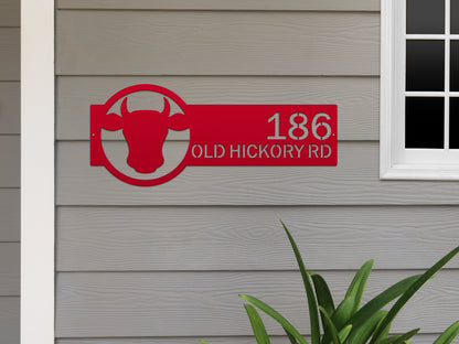 Cattle Farm Monogram Address Sign showcasing a red sign with a cow head, precisely laser-cut from durable American-grade steel, ideal for enhancing farmhouse curb appeal with personalized street numbers.