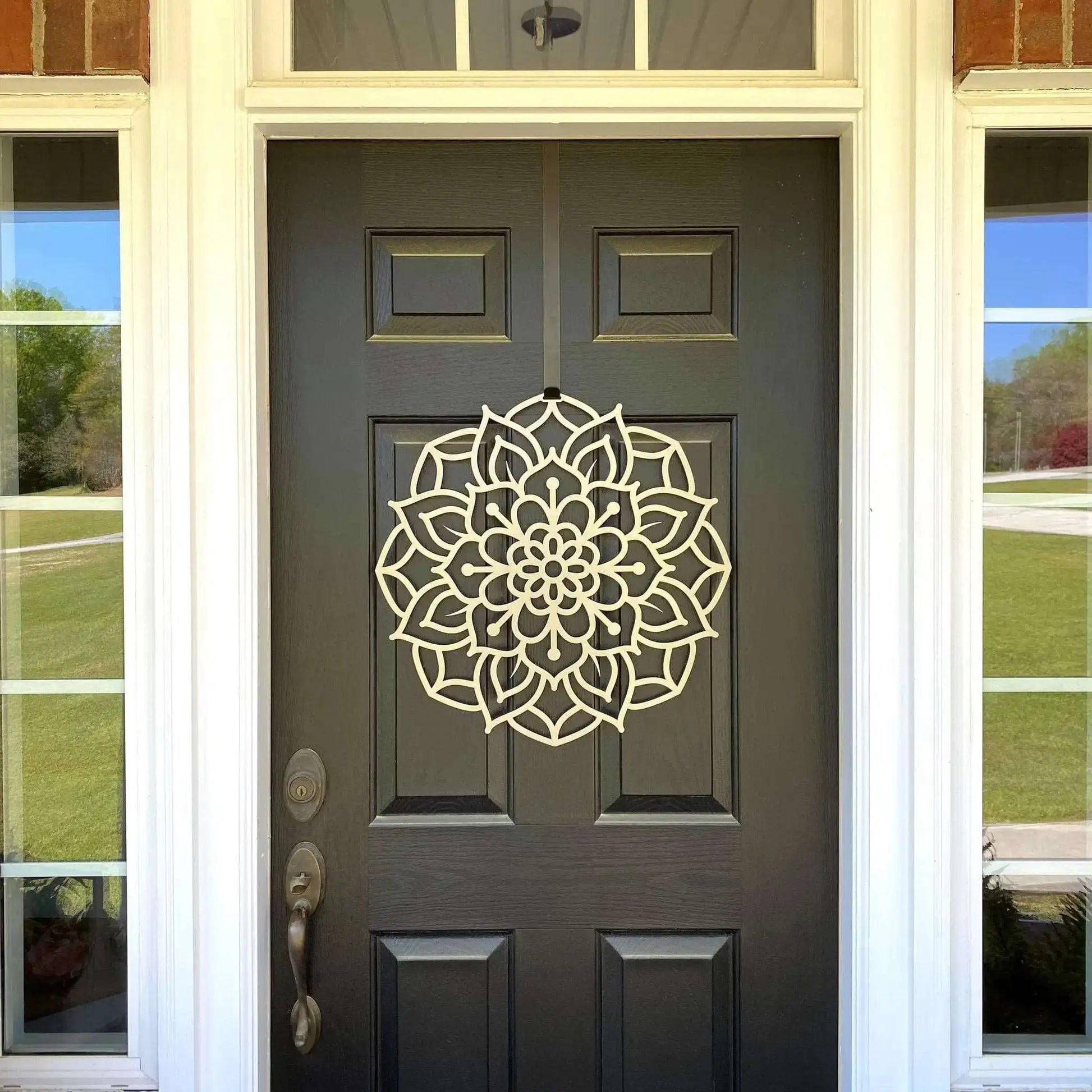 Lotus Mandala Front Door Wreath - Customizable Metal Door Decor, featuring a detailed circular mandala design on a black door, highlighting its elegance and versatility for home or garden use.