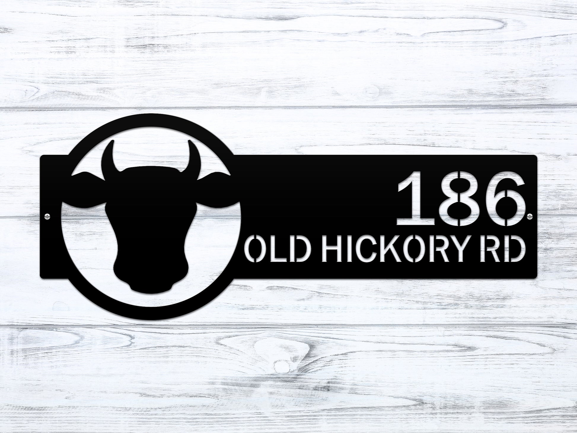 Cattle Farm Monogram Address Sign showcasing a black cow head with custom street numbers, crafted from durable steel for outdoor home decor, ideal as a weather-resistant housewarming gift.