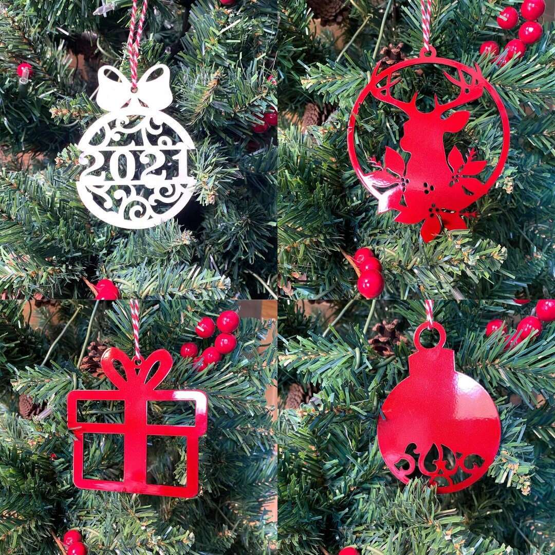 Christmas ornament collection featuring 2021 ornament reindeer gift box and red holiday ball decorations
