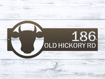 Cattle Farm Monogram Address Sign with custom street numbers, features a metal plaque with a cow head design, precision laser-cut details, ideal for weather-resistant outdoor home decor and housewarming gift.