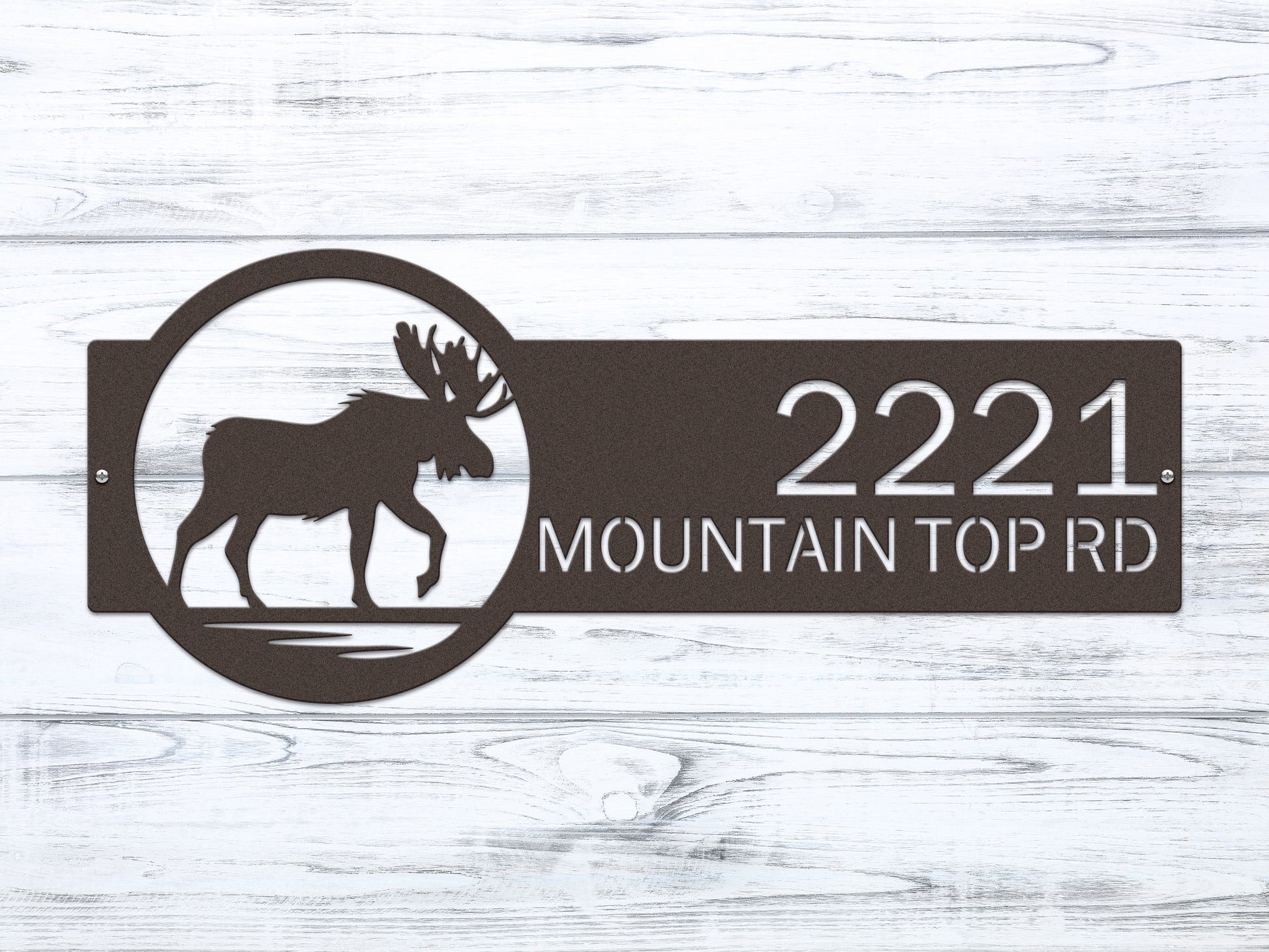 Moose Cabin Address Sign showcasing a laser-cut moose silhouette with customizable house numbers and street name. Crafted from durable steel, this weather-resistant sign adds rustic elegance to your home’s entrance.