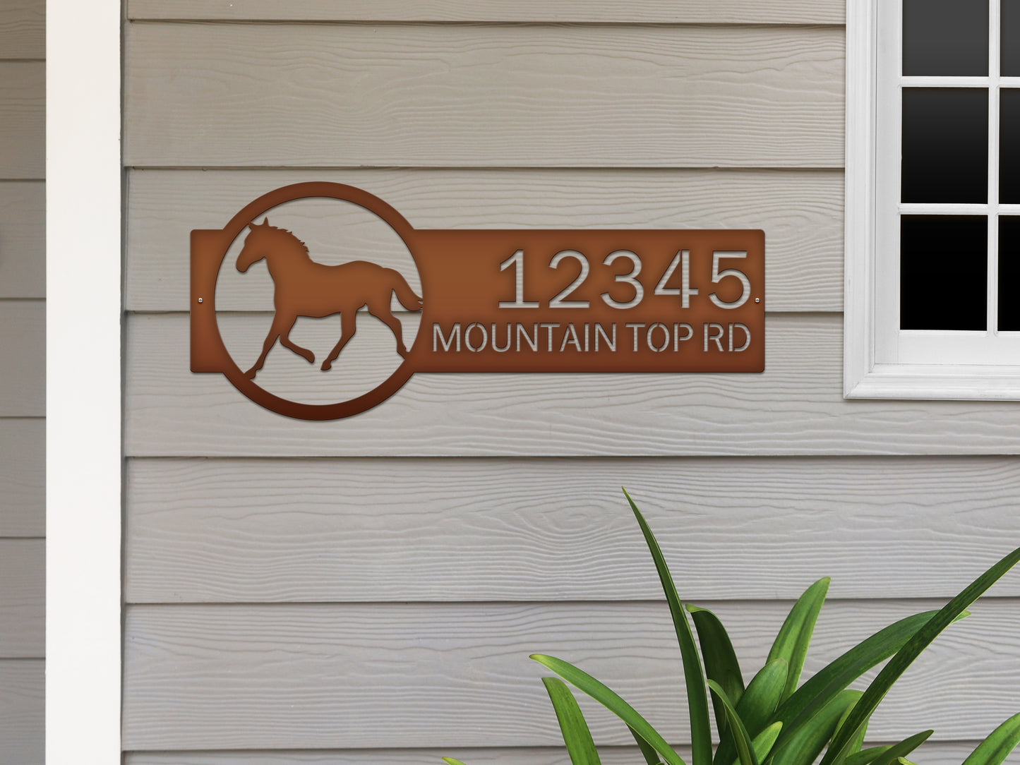 Horse Ranch Address Sign featuring a laser-cut galloping horse graphic, customizable house numbers, and street name. Crafted from durable steel, this weather-resistant sign enhances your property's elegance.