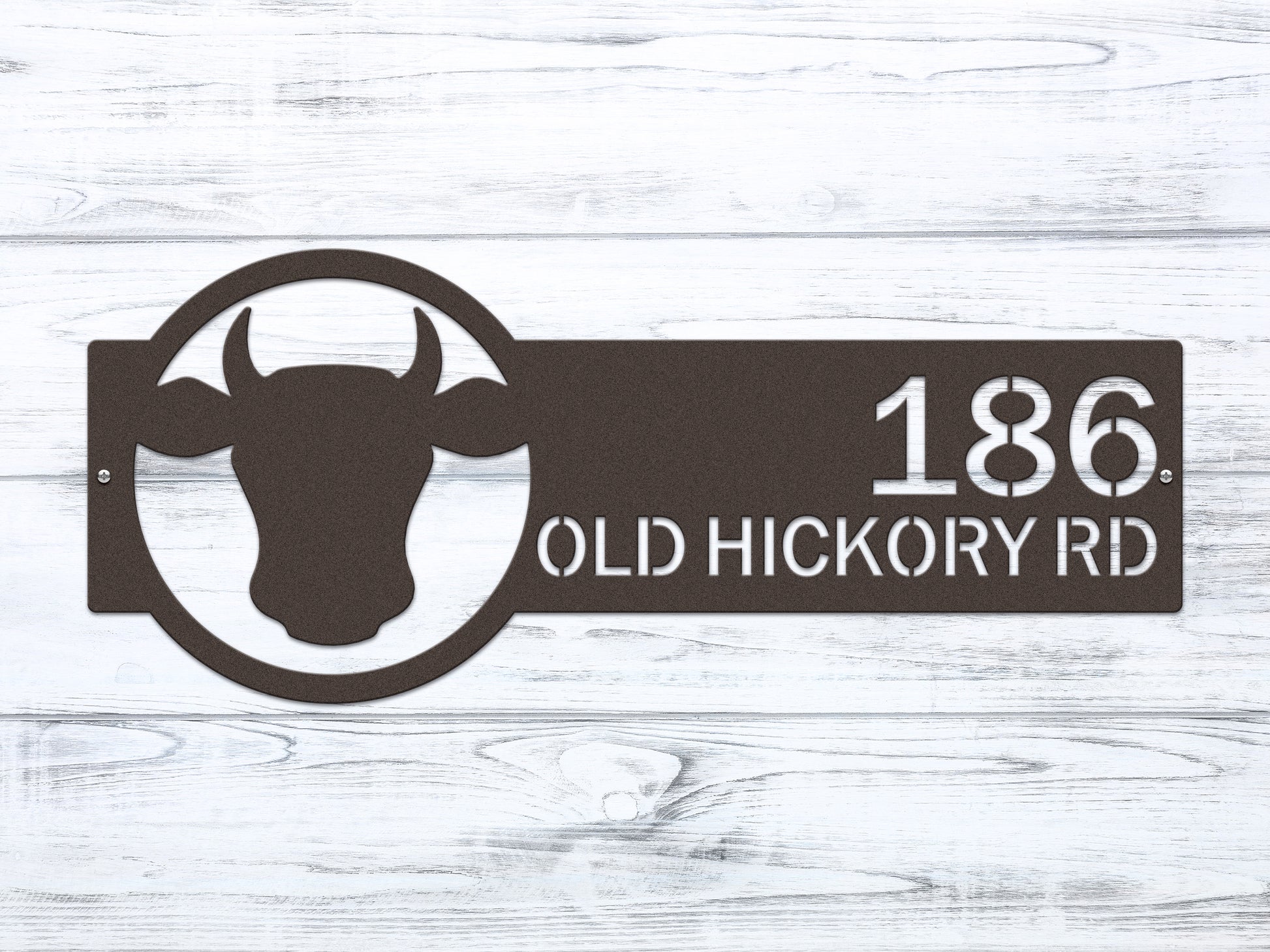 Cattle Farm Monogram Address Sign showcasing a metal cow head design and customizable street numbers, symbolizing weather-resistant outdoor decor, handcrafted for home personalization and ideal as a housewarming gift.