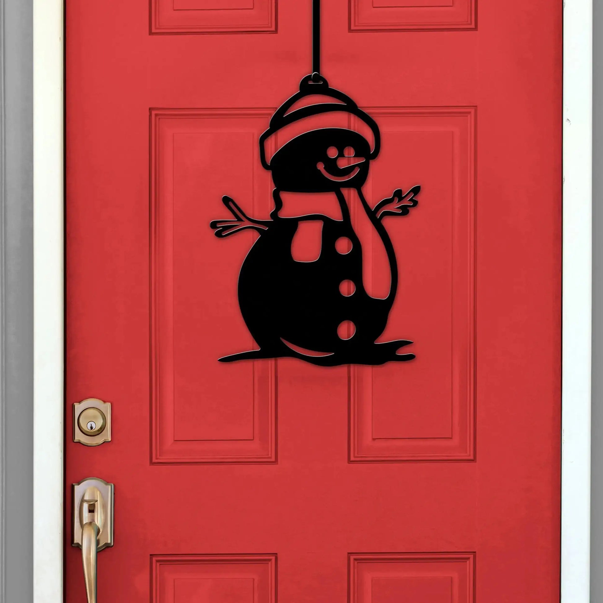 Snowman Door Hanger and Wall Art featuring a black snowman design on a red door, showcasing a festive winter decoration ideal for enhancing your home decor.