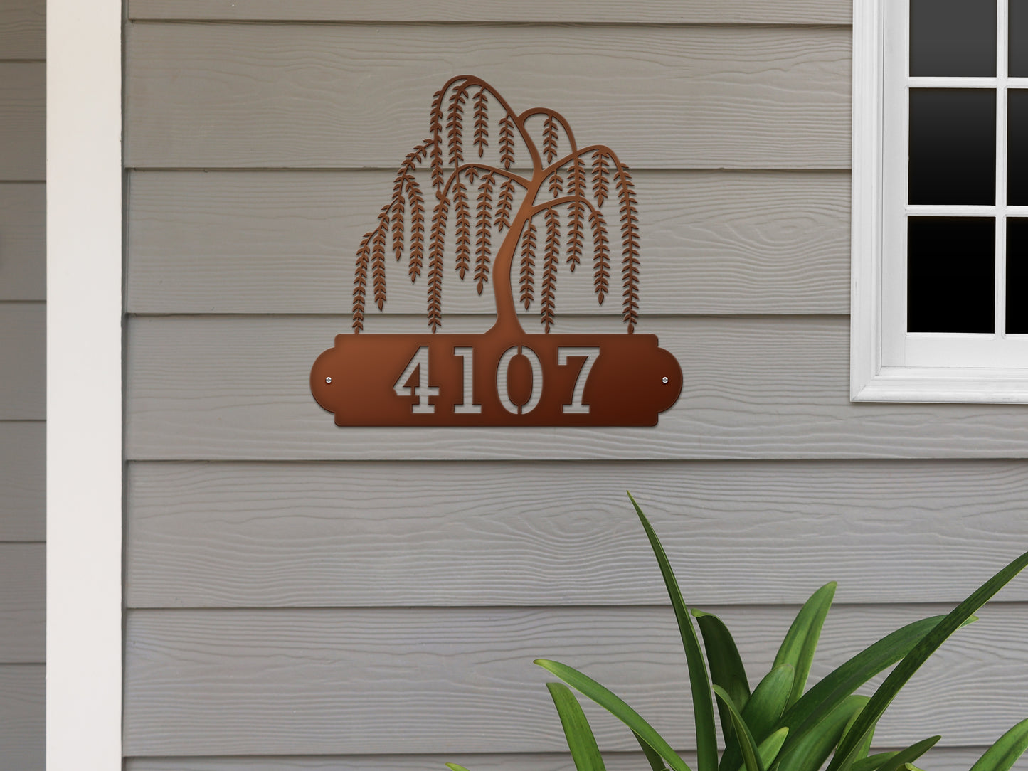 Weeping Willow House Numbers Address Sign, featuring a metal plaque with a tree and customizable numbers, ideal for outdoor home décor. Perfect as a weather-resistant, personalized housewarming gift.