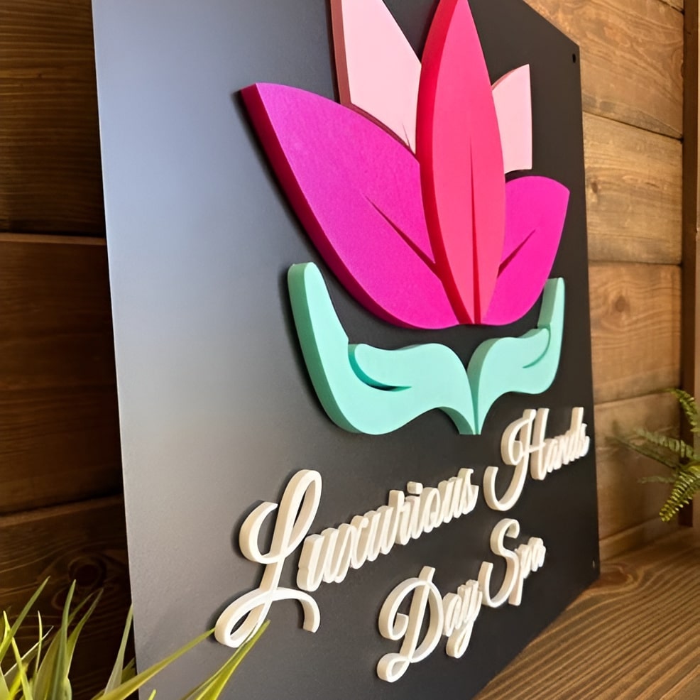 Custom 3D steel decorative sign featuring vibrant floral design, “Luxurious Hands Day Spa” text, multi-material metal wall art on wood background.