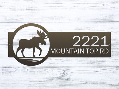 Moose Cabin Address Sign featuring a moose silhouette and customizable house numbers, expertly laser-cut from durable steel for outdoor use, ideal for personalizing home entrances.