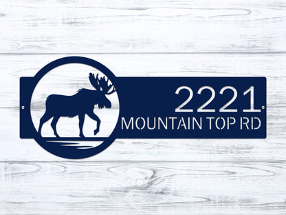 Moose Cabin Address Sign features a blue silhouette of a moose and customizable house numbers, expertly crafted for outdoor durability and elegance, ideal for enhancing home curb appeal.