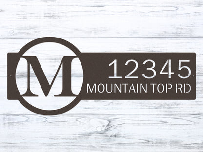 Metal Monogram Address Sign showcasing a personalized monogram and house numbers, expertly laser-cut from steel, ideal for home décor and housewarming gifts, emphasizing weather-resistant quality and customization options.