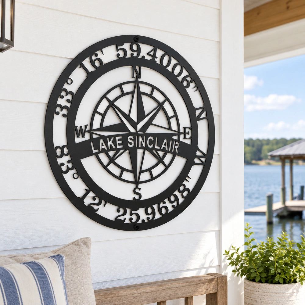 a metal compass on the side of a house