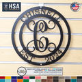 HSA-branded personalized monogram metal wall décor with family name “CHISNELL” and “EST. 2024” on a wooden background, ideal for 6th anniversary gifts, indoor or outdoor home décor, and custom family name signage.
