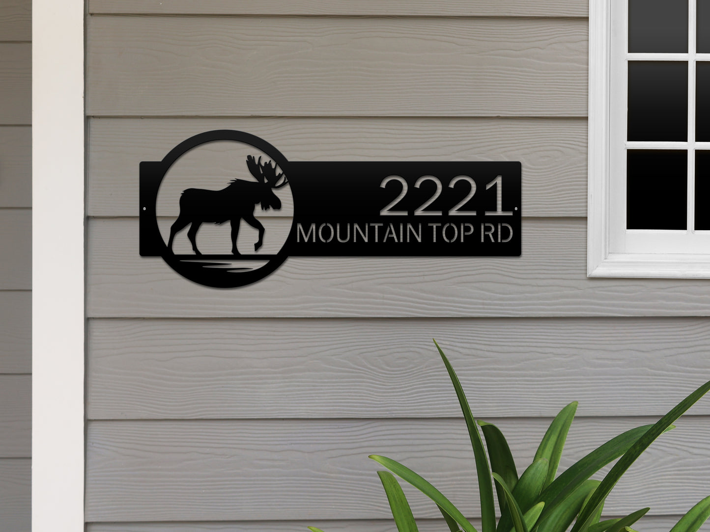 Moose Cabin Address Sign with custom house numbers and street name, featuring a black moose silhouette in a circular design, expertly laser cut from durable steel for outdoor home décor.