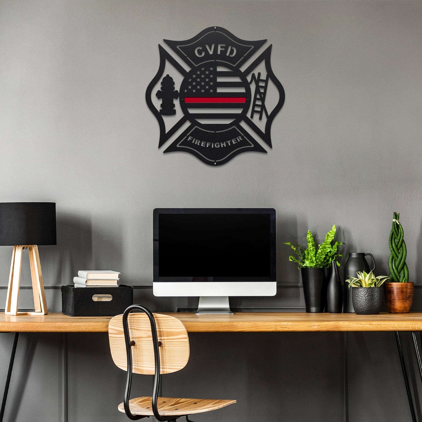 American Flag Firefighter Custom Metal Maltese Cross Sign displayed on a desk, featuring a firefighter cross design with a red line and customizable text, ideal for personalized fire department décor.