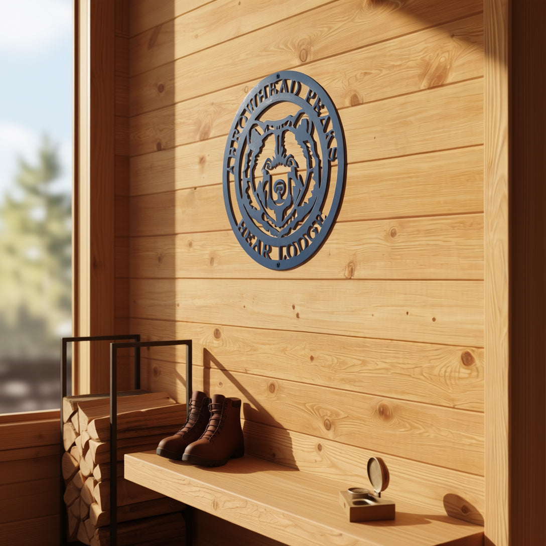 Personalized bear lodge metal wall décor mounted on wood cabin entryway wall with bench boots and warm natural lighting