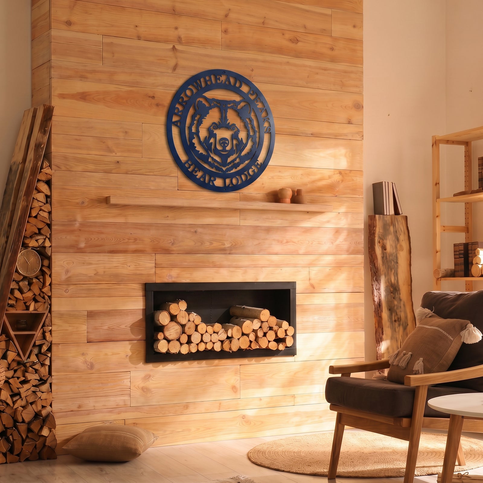 Custom bear lodge metal wall sign displayed above modern fireplace in cozy rustic cabin interior with natural wood accents