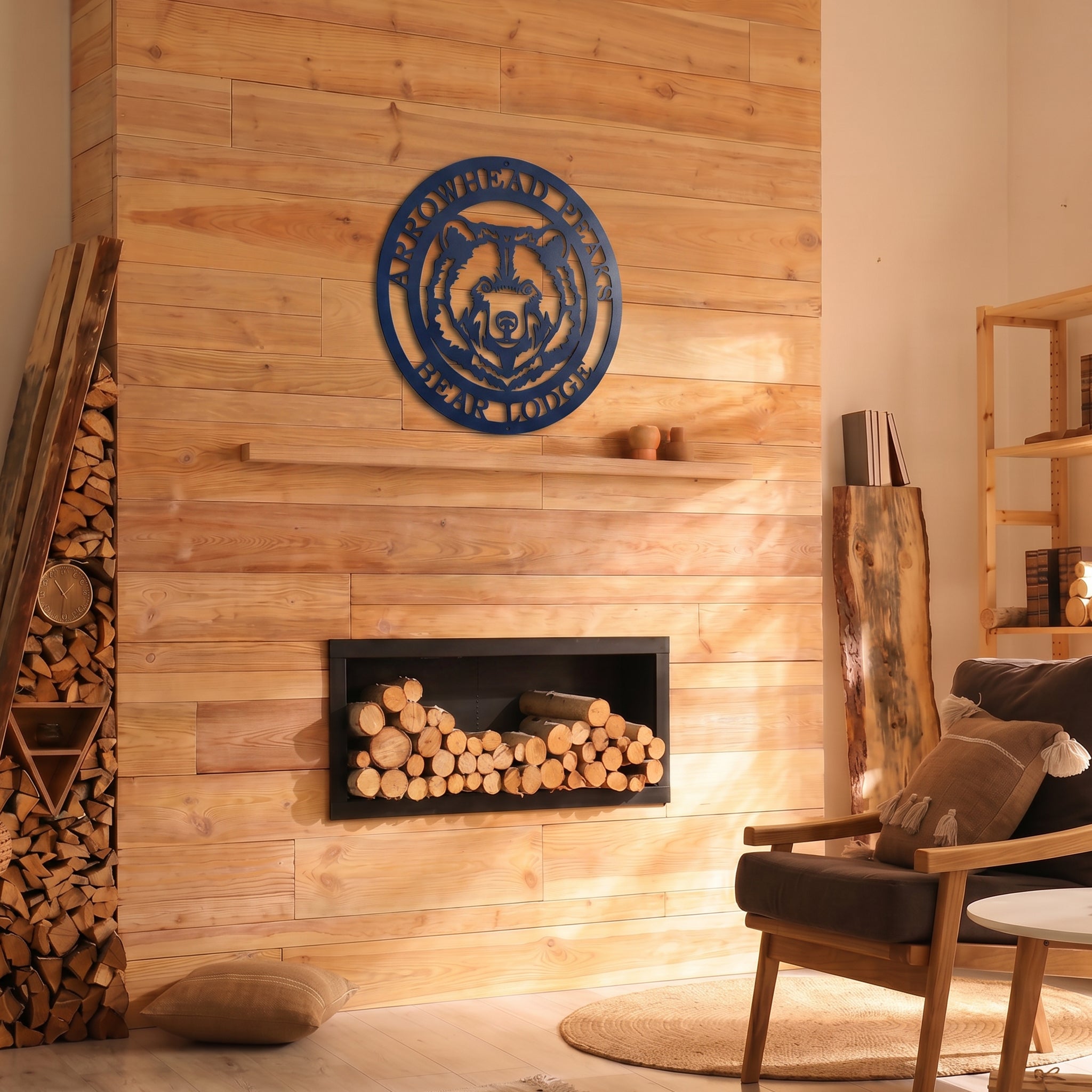 Custom bear lodge metal wall sign displayed above modern fireplace in cozy rustic cabin interior with natural wood accents
