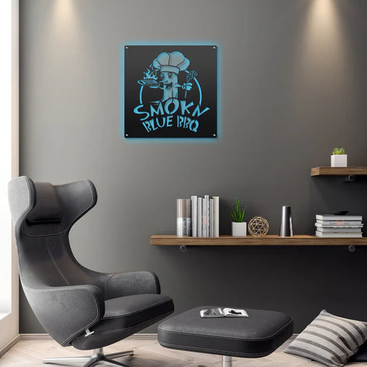 Blue LED sign says "SMOKN BLUE BBQ" with cartoon chef holding spatula and flaming plate, mounted on wall for storefront.