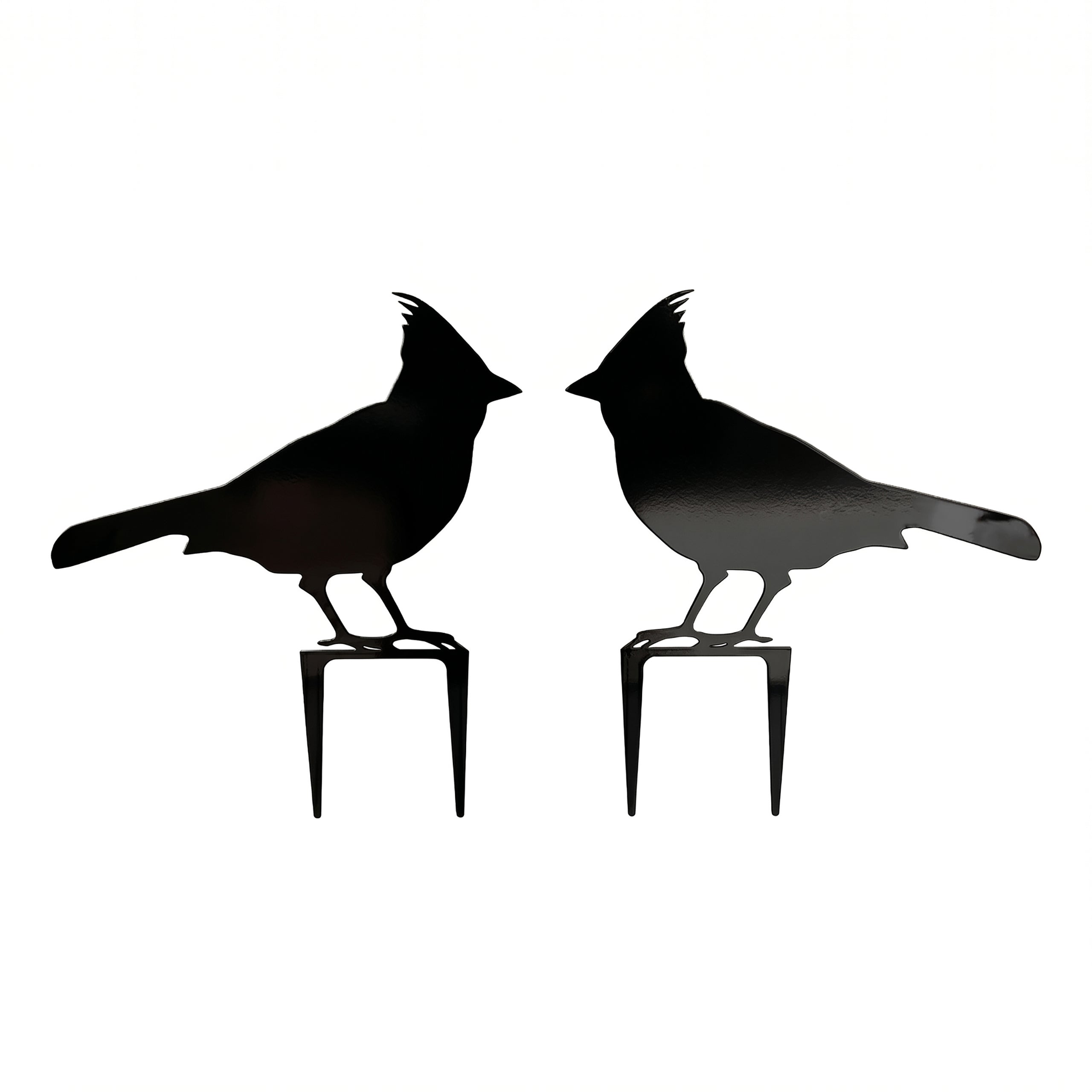 Pair of black cardinal metal garden stakes with mirrored bird silhouettes on a clean white background