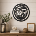 sea turtle metal wall decor hanging above wooden console table with modern coastal farmhouse styling
