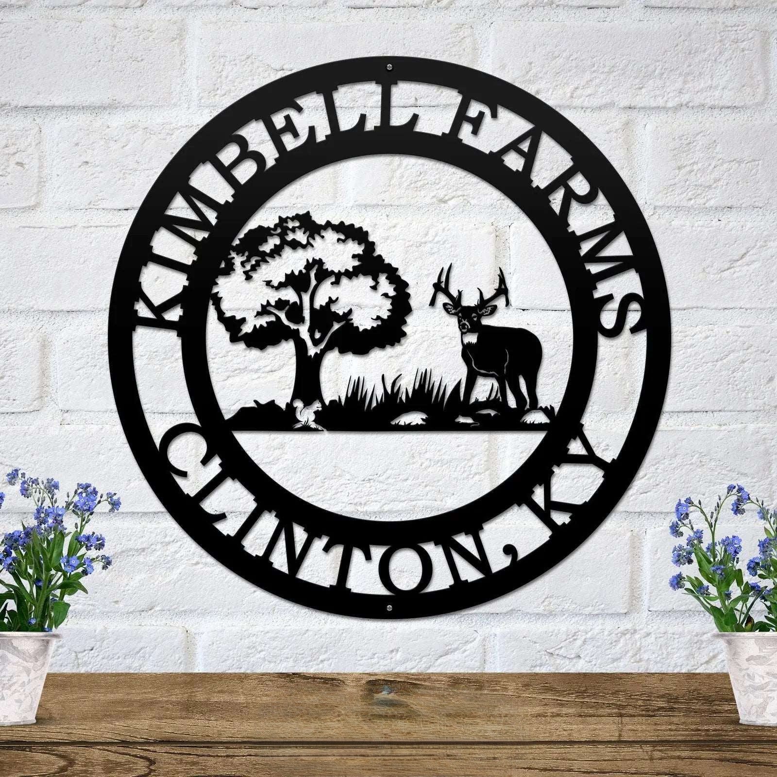 Black personalized deer scene metal wall art featuring buck deer tree landscape and custom cabin name
