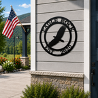 Black eagle metal wall sign with Eagle Rock and Est 2020 displayed beside a front door with an American flag