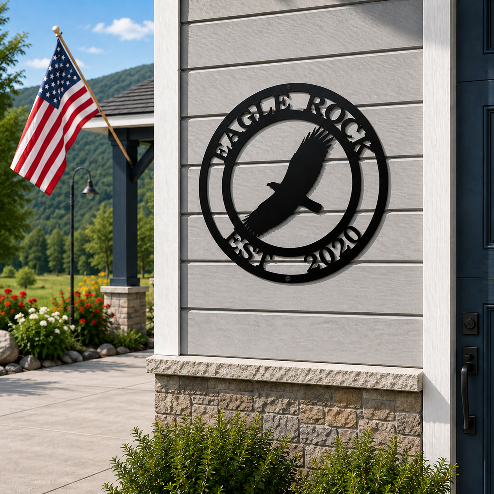 Black eagle metal wall sign with Eagle Rock and Est 2020 displayed beside a front door with an American flag