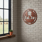 Black Forest View Farm metal sign with horse and trees displayed on a white fence post overlooking pasture land
