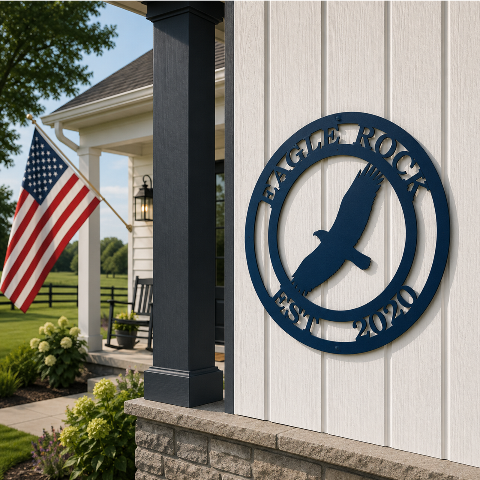 Blue Eagle Rock metal wall decor with soaring eagle and Est 2020 mounted on white siding near a farmhouse porch