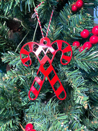 Candy Canes Christmas Ornament - Metal Tree Ornaments feature a red metal candy cane ornament hanging on a Christmas tree, showcasing durable craftsmanship ideal for festive farmhouse décor and gifting.