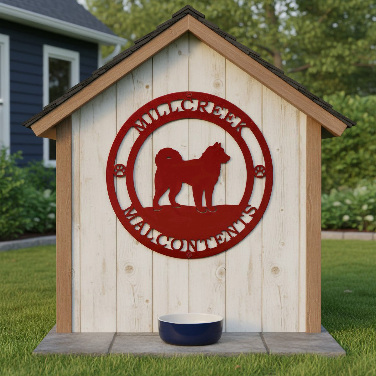 Red Mill Creek Malcontents dog metal sign mounted on a white dog house with pet bowl and backyard setting