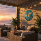 Teal round metal sign with palm trees and sun, personalized for Carolina Beach on a rustic wooden patio wall.