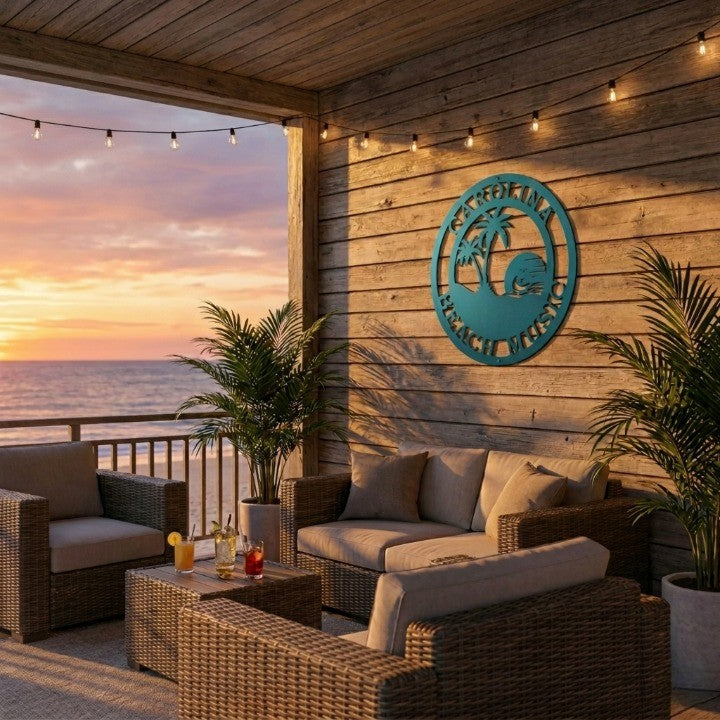 Teal round metal sign with palm trees and sun, personalized for Carolina Beach on a rustic wooden patio wall.