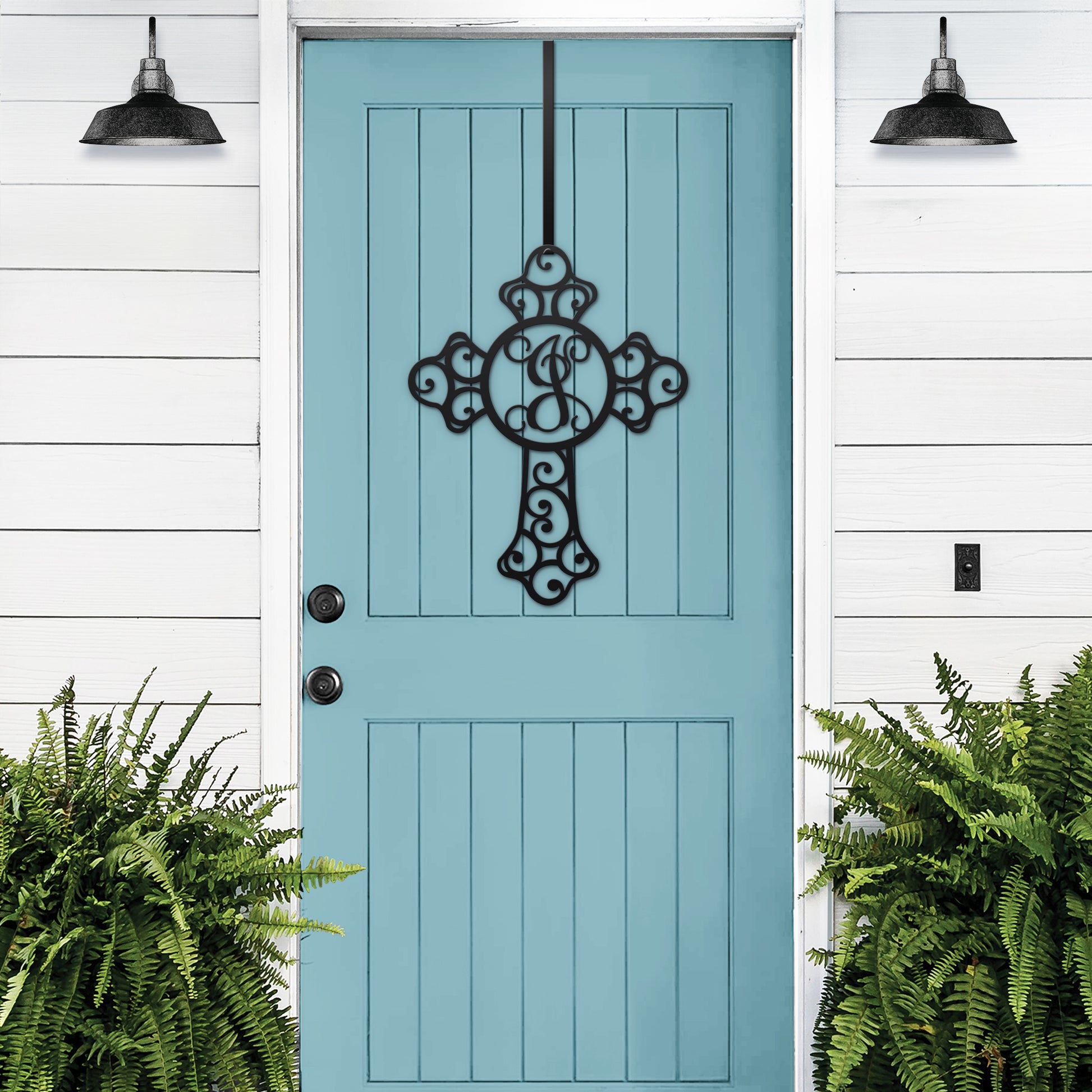 Custom Swirl Monogram Cross Door Sign - Personalized Metal Sign displayed on a blue door, adorned with a black cross and letter, enhancing home and garden decor with a touch of faith.