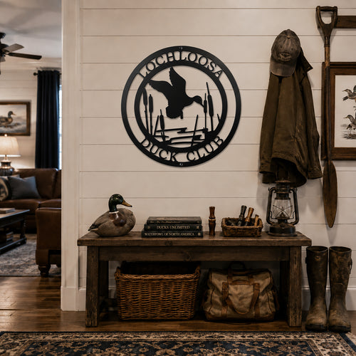 Black duck club metal wall sign with flying duck cattails and hunting lodge decor setting