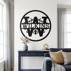 Personalized Wilkinson metal monogram wall decor displayed in a bright modern living room with navy furniture