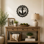 Custom nautical anchor metal wall decor with family name and established date styled above wooden entryway table with lamp and greenery