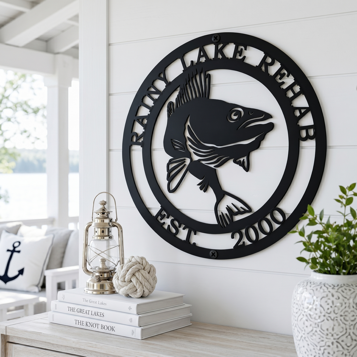 Personalized fish metal wall art displayed on bright coastal farmhouse wall with nautical accents