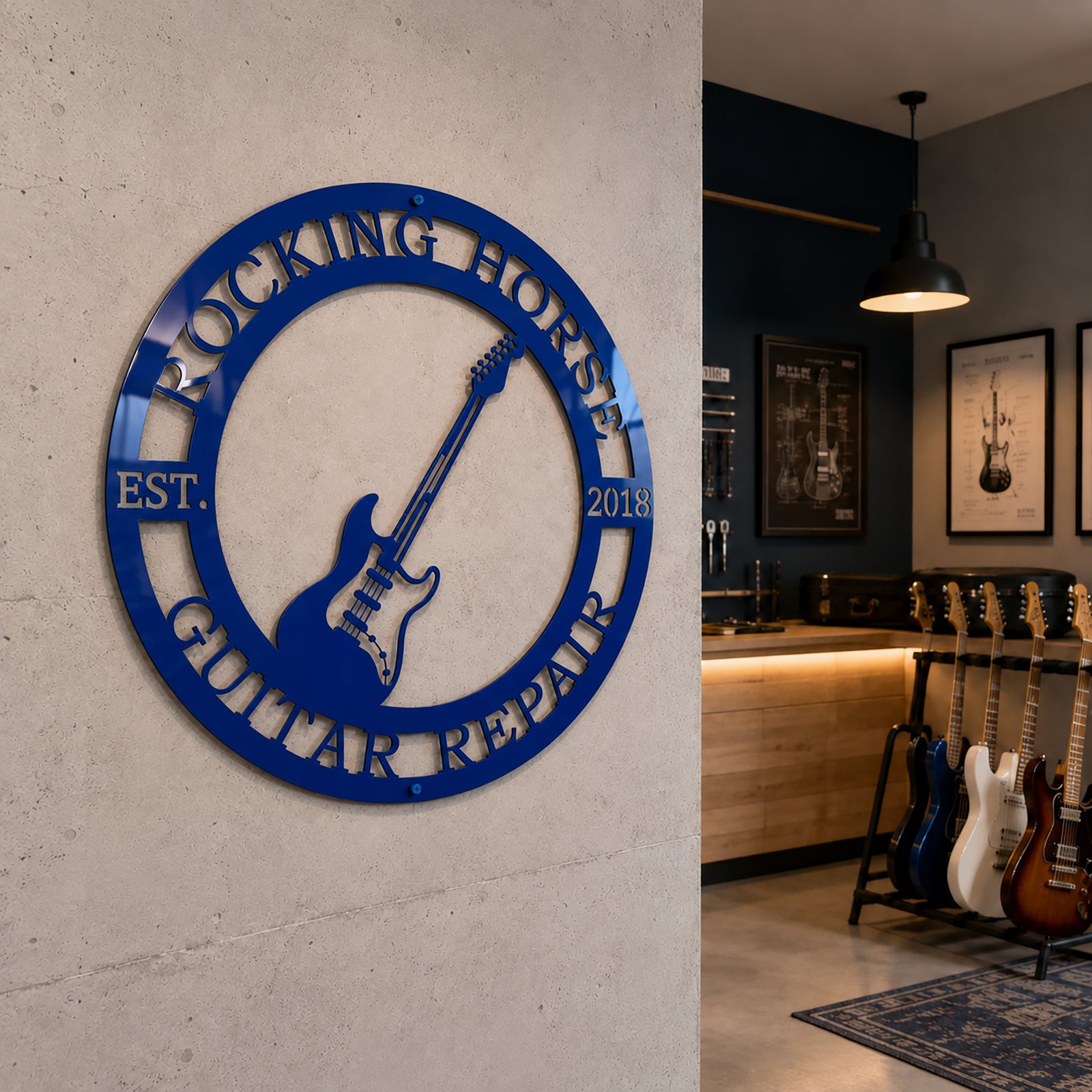 Cobalt blue finish of the personalized rock music metal sign displayed on a concrete studio wall next to a rack of electric guitars.