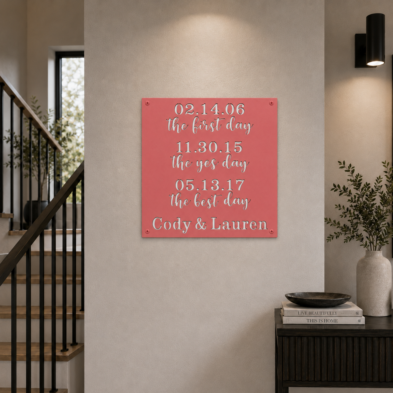 Custom couples timeline metal sign — personalized coral pink anniversary wall decor featuring custom relationship dates mounted on a contemporary home wall.