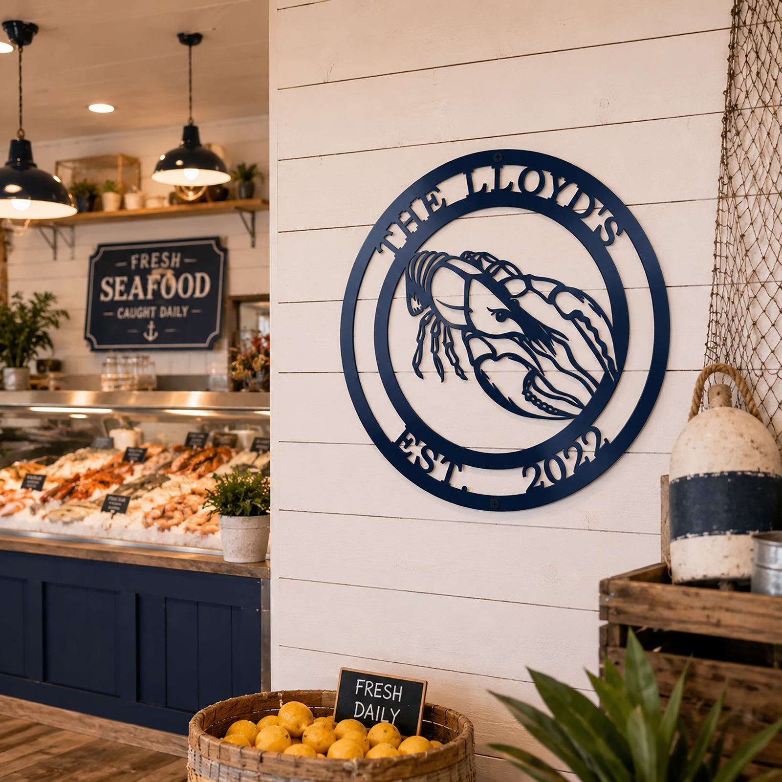 Navy blue crawfish metal sign with The Lloyds and Est 2022 displayed on seafood market wall