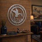 Raw metal duck club wall decor with flying duck and cattails on rustic wood entry wall