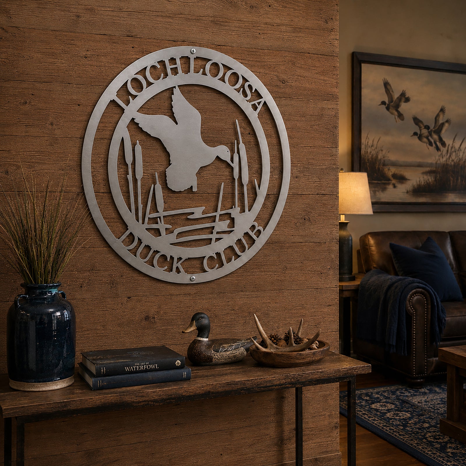 Raw metal duck club wall decor with flying duck and cattails on rustic wood entry wall