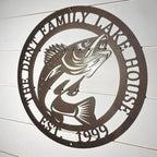 Custom family lake house fish metal sign with established year on white shiplap wall